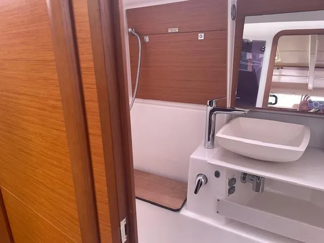 Epiphany Yacht Photos Pics Modern bathroom in 2022 Dufour 430 yacht with sleek sink and shower.