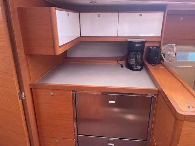 Epiphany Yacht Photos Pics Modern kitchen area in 2022 Dufour 430 yacht with appliances and storage cabinets.