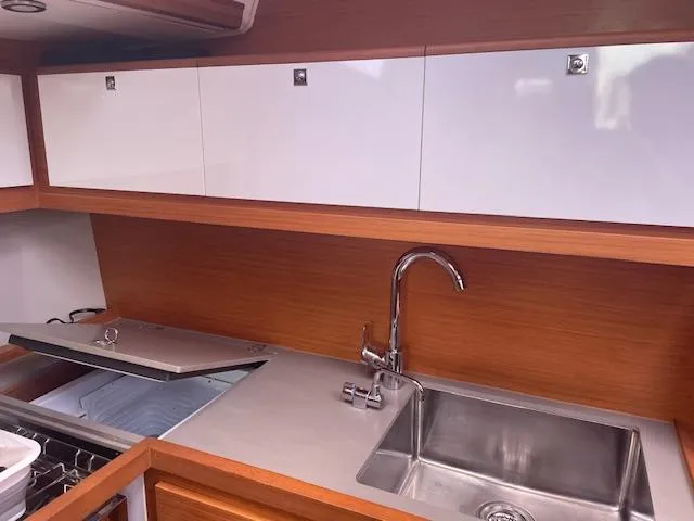 Epiphany Yacht Photos Pics Modern kitchen in 2022 Dufour 430 yacht with sleek cabinetry and stainless steel sink.