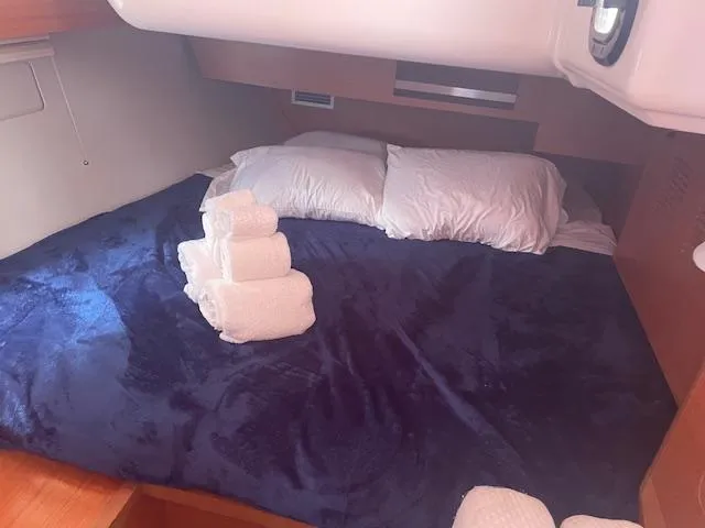 Epiphany Yacht Photos Pics Cozy cabin bed in 2022 Dufour 430 yacht with plush bedding and towels.