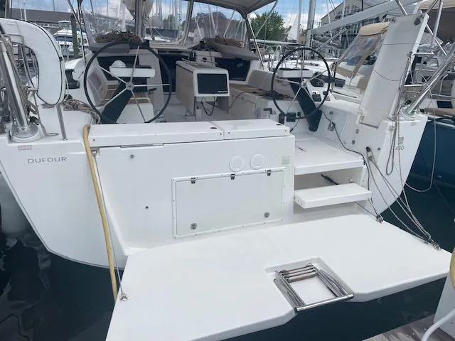 Epiphany Yacht Photos Pics 2022 Dufour 430 yacht cockpit with dual steering wheels and modern navigation equipment.