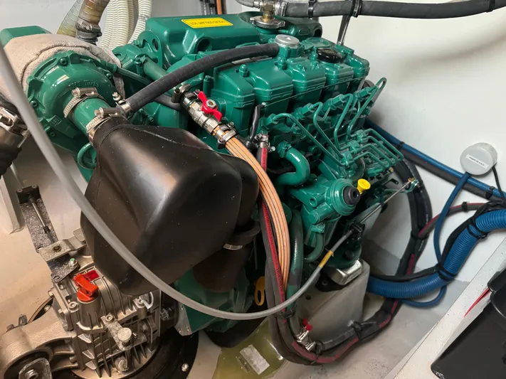 Stock Neel 47 Yacht Photos Pics 2023 NEEL 47 engine compartment with green machinery and wiring.