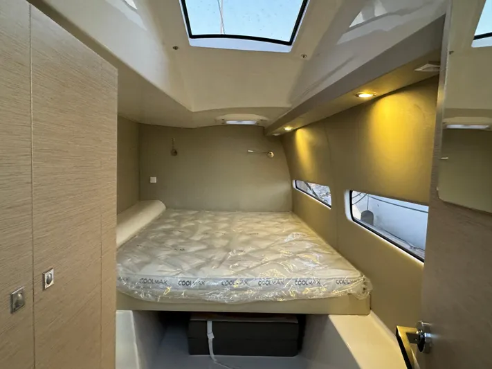 Stock Neel 47 Yacht Photos Pics Modern NEEL 47 cabin interior with skylight and cozy bed, 2023 model.