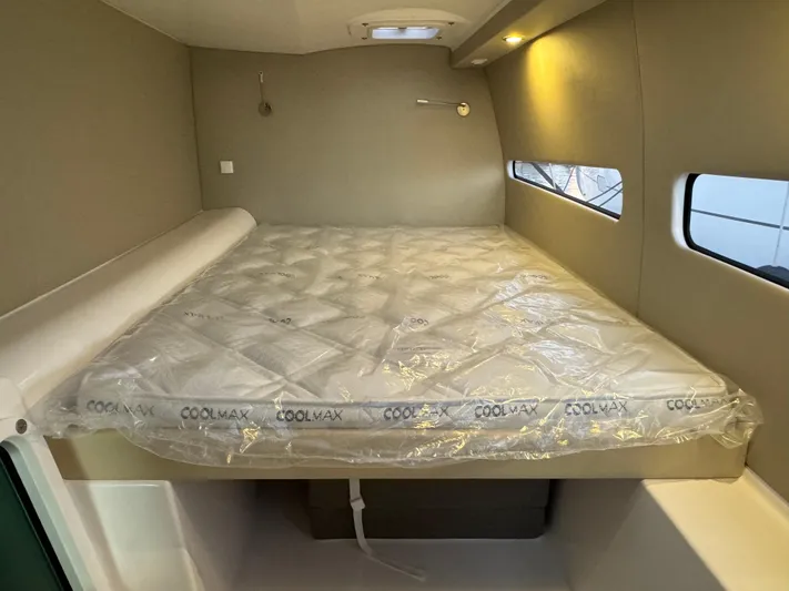 Stock Neel 47 Yacht Photos Pics Cozy cabin interior of 2023 NEEL 47 with Coolmax mattress and ambient lighting.