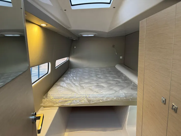 Stock Neel 47 Yacht Photos Pics Modern NEEL 47 cabin interior with skylight and cozy bed, 2023 model.