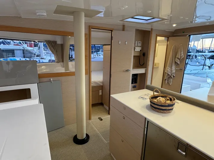 Stock Neel 47 Yacht Photos Pics Interior of 2023 NEEL 47 yacht, featuring modern kitchen and cozy cabin space.