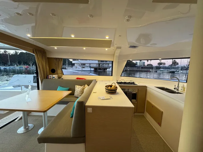 Stock Neel 47 Yacht Photos Pics Modern NEEL 47 yacht interior with dining area and kitchen, 2023 model.