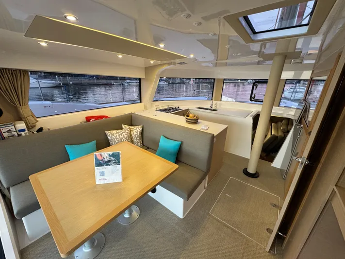 Stock Neel 47 Yacht Photos Pics Modern NEEL 47 yacht interior with dining area and kitchen, 2023 model.