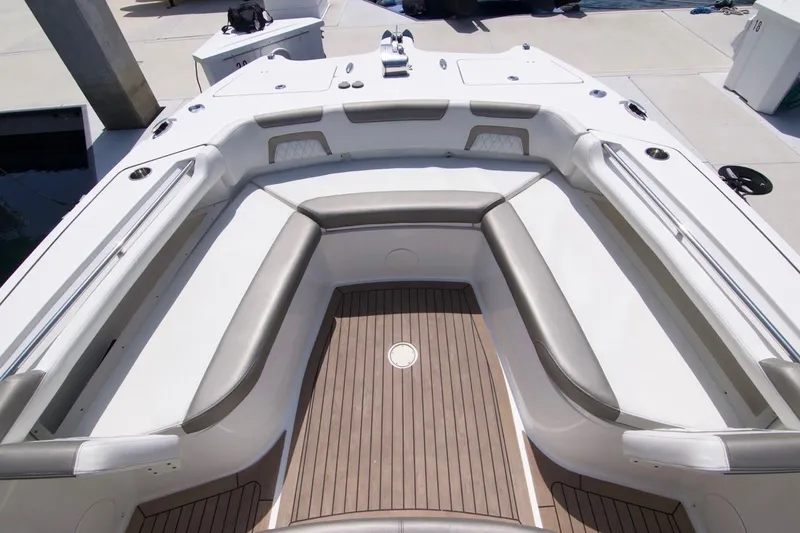  Yacht Photos Pics 2023 World Cat 325 CC boat interior with spacious seating and sleek design.