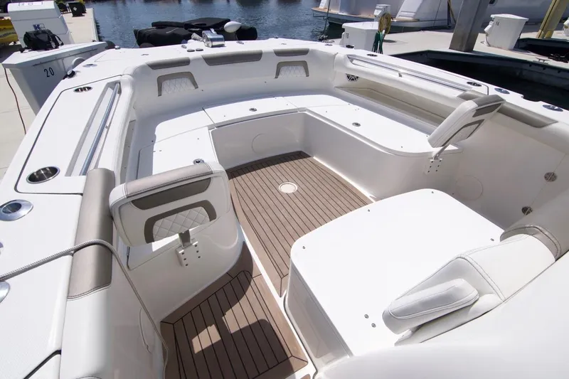  Yacht Photos Pics 2023 World Cat 325 CC boat interior with spacious seating and sleek design.