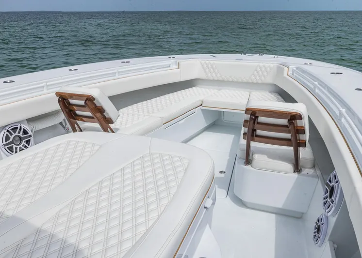  Yacht Photos Pics Luxurious seating on 2025 Invincible 43 Open Fisherman boat, ocean backdrop.