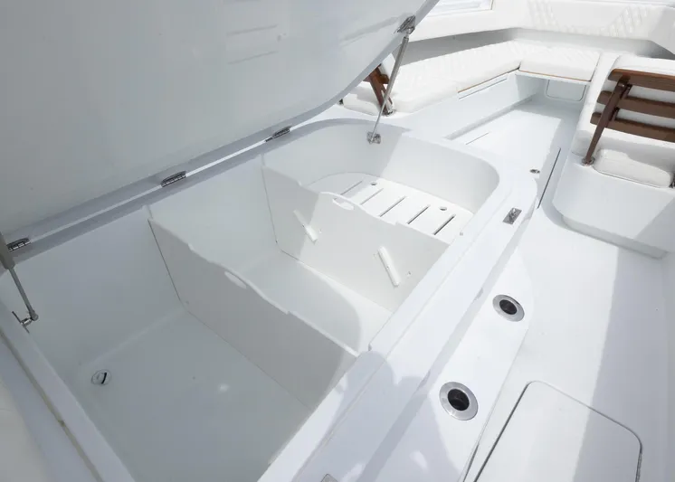  Yacht Photos Pics 2025 Invincible 43 Open Fisherman boat interior with open storage compartment.