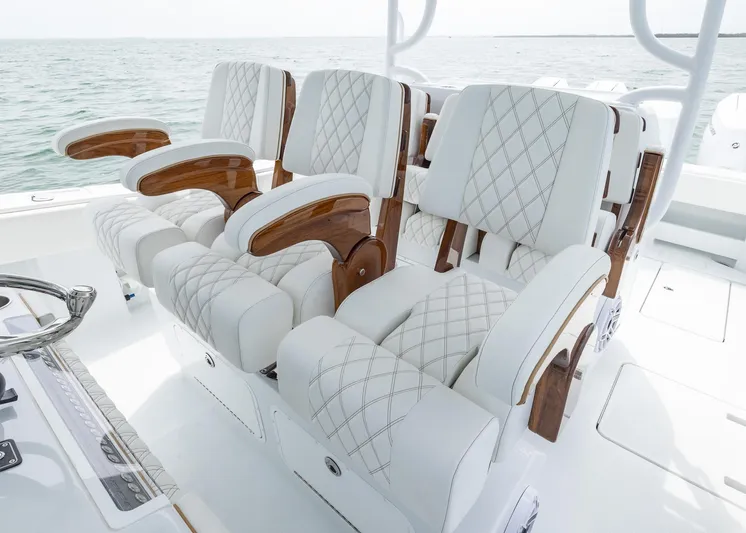  Yacht Photos Pics Luxurious seating on 2025 Invincible 43 Open Fisherman boat, featuring elegant white upholstery.