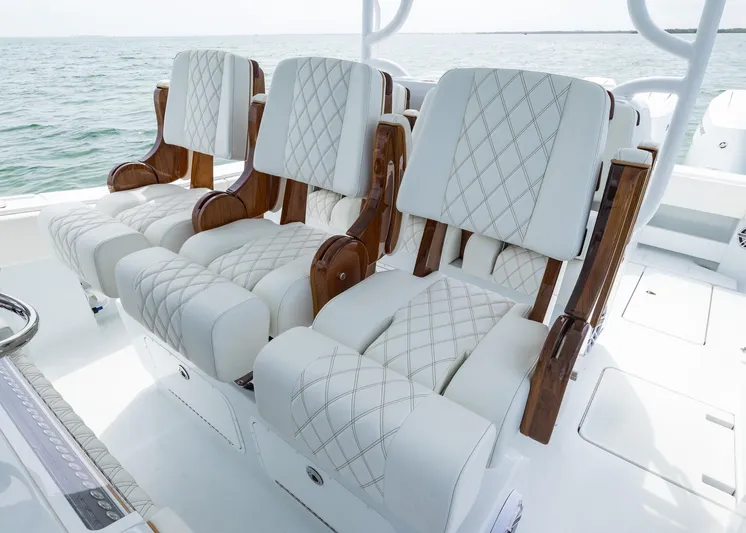  Yacht Photos Pics Luxurious seating on 2025 Invincible 43 Open Fisherman boat, featuring elegant white upholstery.