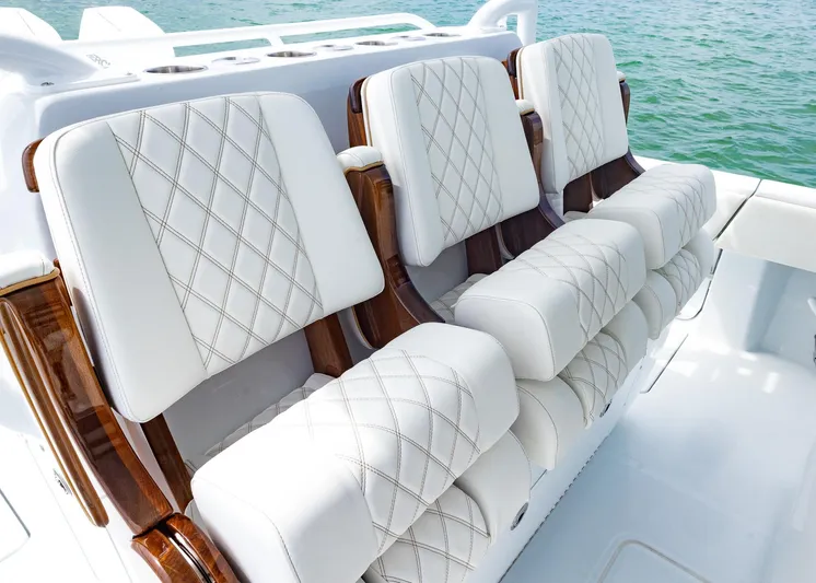  Yacht Photos Pics Luxurious seating on 2025 Invincible 43 Open Fisherman boat, featuring elegant white upholstery.