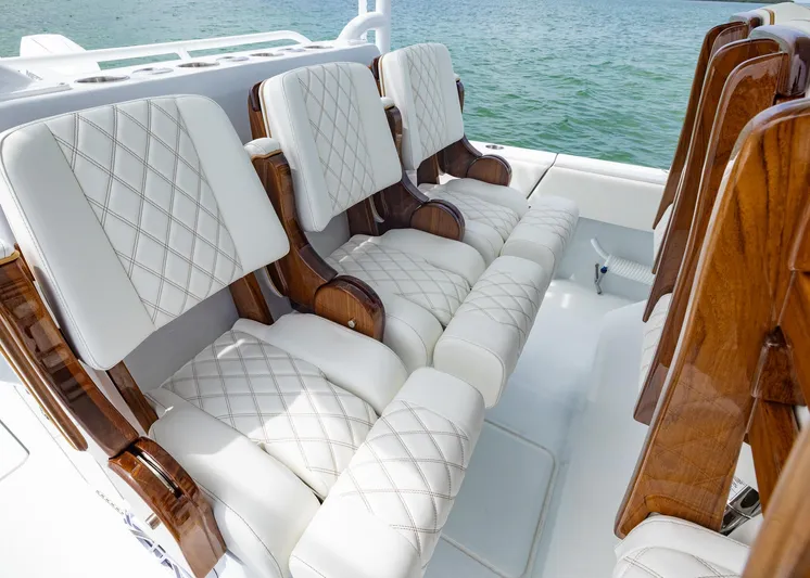 Yacht Photos Pics Luxurious seating on 2025 Invincible 43 Open Fisherman boat with quilted white upholstery.