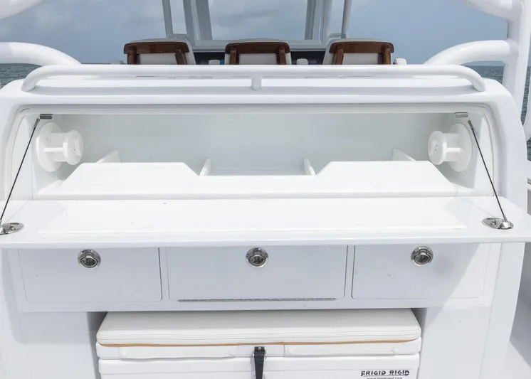  Yacht Photos Pics 2025 Invincible 43 Open Fisherman boat with storage compartments and seating.