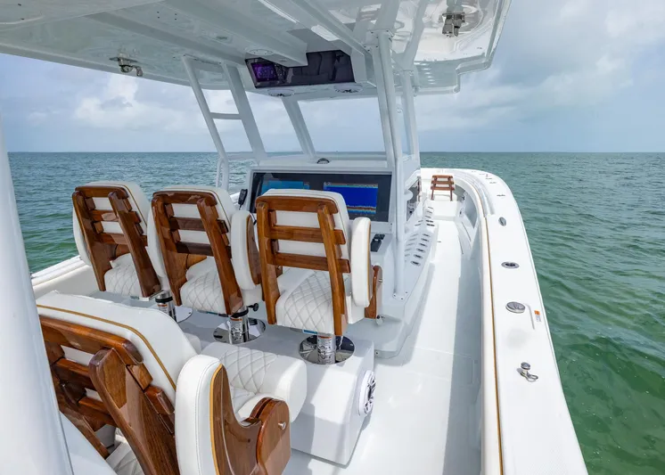  Yacht Photos Pics 2025 Invincible 43 Open Fisherman boat with luxurious seating on open water.