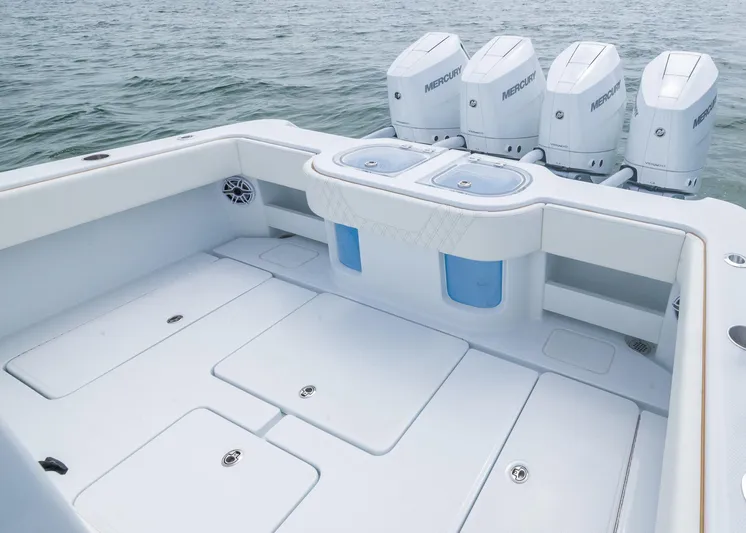  Yacht Photos Pics 2025 Invincible 43 Open Fisherman boat with quad Mercury engines on calm water.