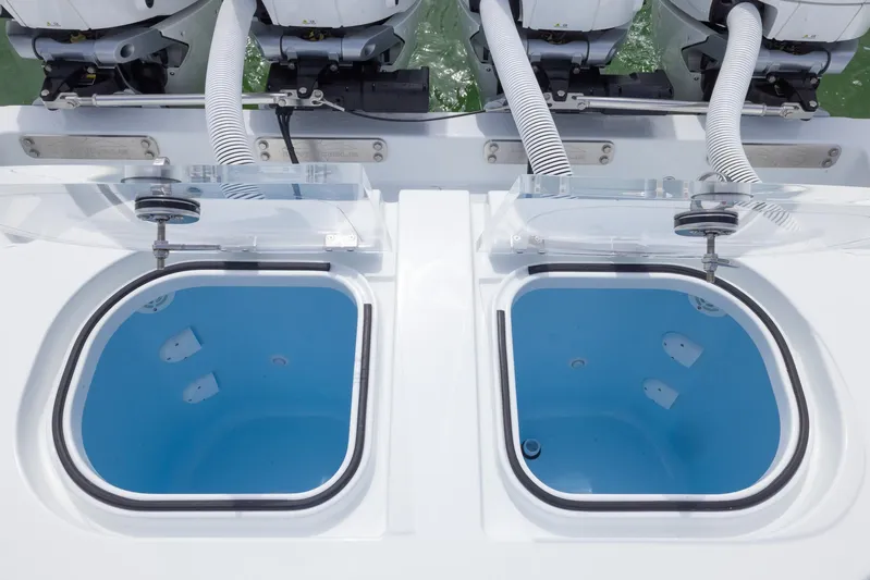  Yacht Photos Pics Livewell compartments on 2025 Invincible 43 Open Fisherman boat, featuring dual outboard engines.