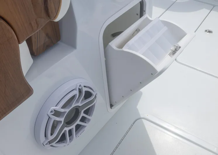  Yacht Photos Pics 2025 Invincible 43 Open Fisherman boat with storage compartment and speaker detail.