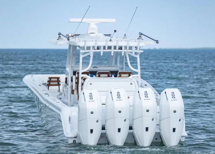  Yacht Photos Pics 2025 Invincible 43 Open Fisherman boat with four powerful outboard engines on the ocean.