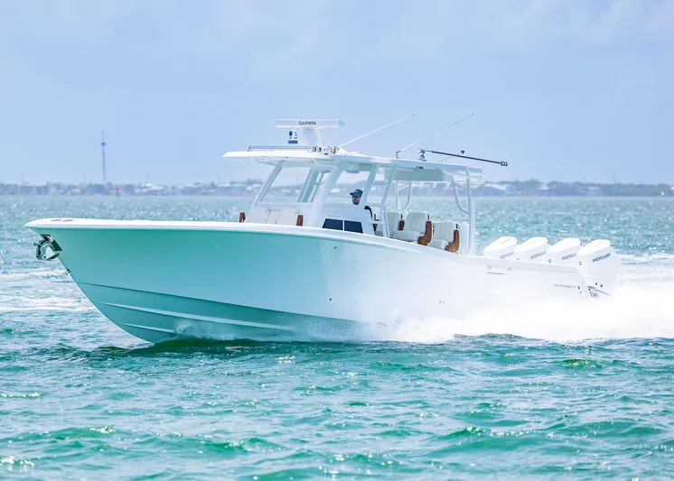  Yacht Photos Pics 2025 Invincible 43 Open Fisherman boat cruising on open water.