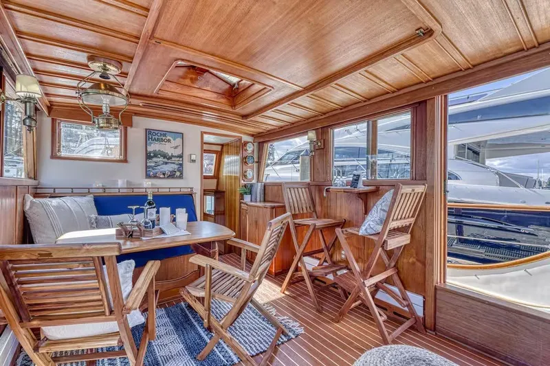  Yacht Photos Pics Luxurious 1981 Nielsen 46 yacht interior with wooden decor and comfortable seating.