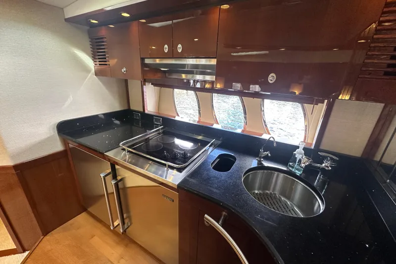 Knot Rite Yacht Photos Pics Luxurious kitchen interior of 2009 Sea Ray 60 Sundancer yacht with modern appliances.