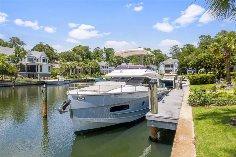 Tangerine Moon Yacht Photos Pics Azimut Magellano 43 yacht docked in a scenic residential marina, 2014 model.