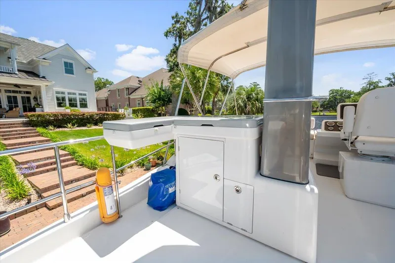 Tangerine Moon Yacht Photos Pics 2014 Azimut Magellano 43 yacht deck with outdoor seating and scenic view.