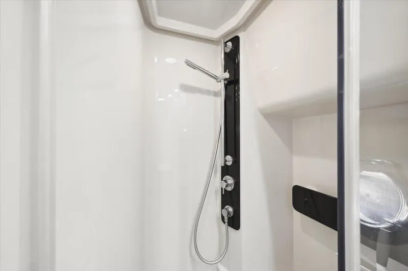 Tangerine Moon Yacht Photos Pics Shower area in 2014 Azimut Magellano 43 yacht, featuring modern fixtures and sleek design.