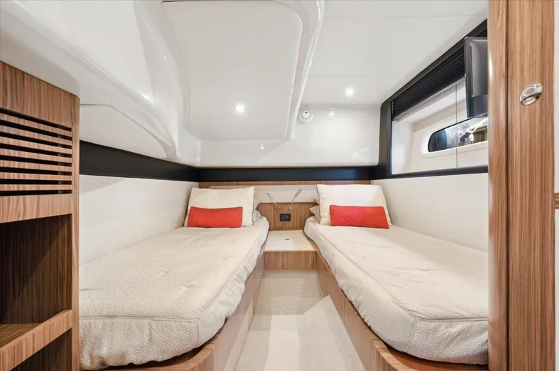 Tangerine Moon Yacht Photos Pics Luxurious cabin interior of 2014 Azimut Magellano 43 yacht with twin beds and modern design.