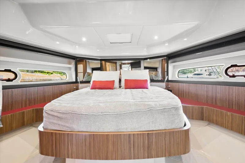 Tangerine Moon Yacht Photos Pics Luxurious bedroom interior of 2014 Azimut Magellano 43 yacht with modern design and cozy bedding.
