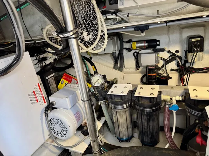 Tangerine Moon Yacht Photos Pics Engine room of 2014 Azimut Magellano 43 yacht, showcasing mechanical components and wiring.