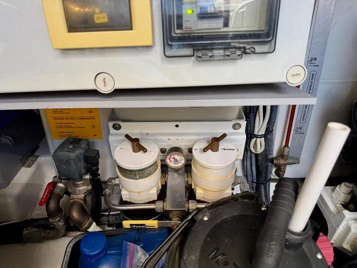 Tangerine Moon Yacht Photos Pics Engine room of 2014 Azimut Magellano 43 yacht, featuring fuel filters and gauges.