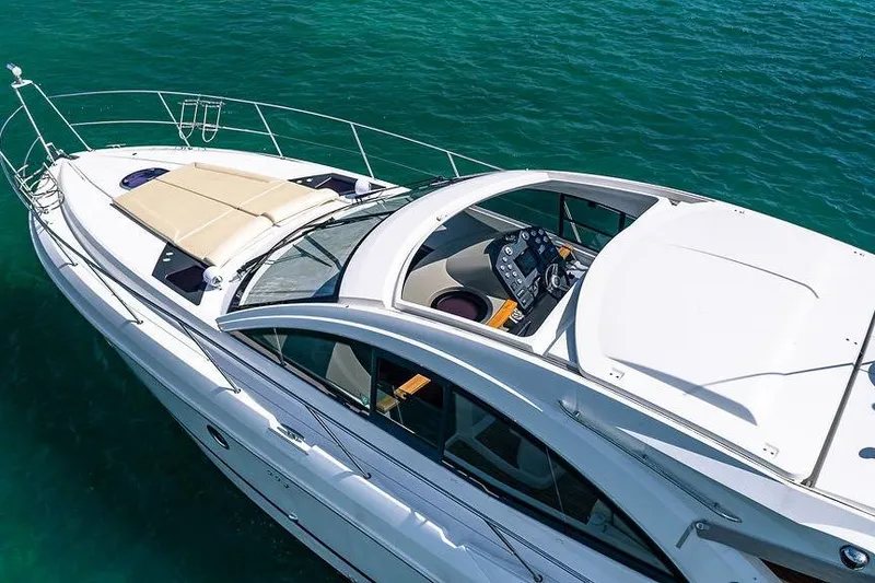 Alegria Yacht Photos Pics 2015 Beneteau Gran Turismo 44 yacht on clear blue water, aerial view.