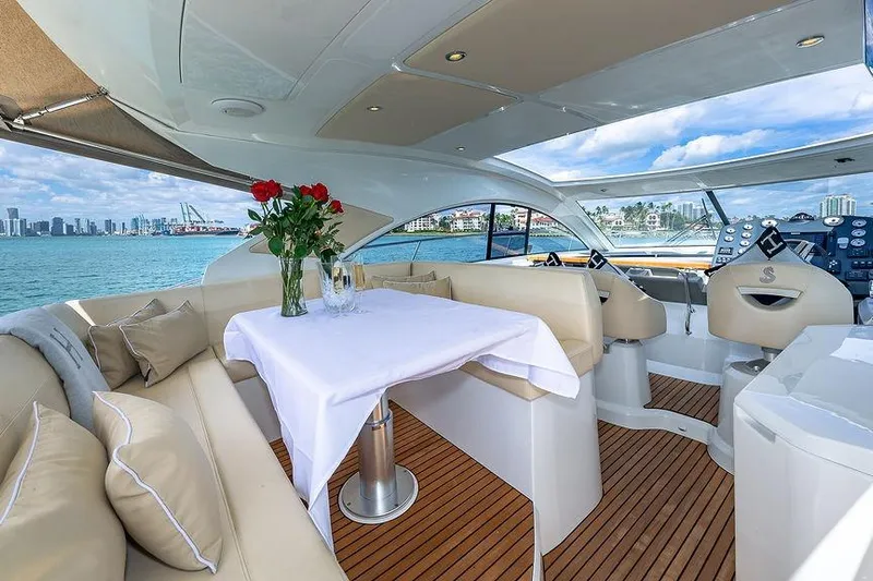 Alegria Yacht Photos Pics Luxurious interior of 2015 Beneteau Gran Turismo 44 yacht with elegant seating and ocean view.