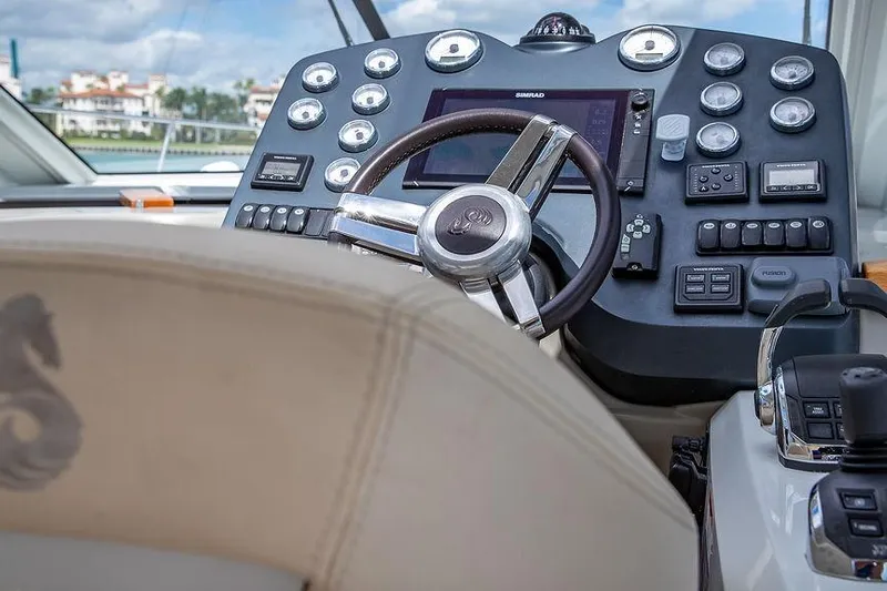 Alegria Yacht Photos Pics Steering console of 2015 Beneteau Gran Turismo 44 yacht with modern controls.