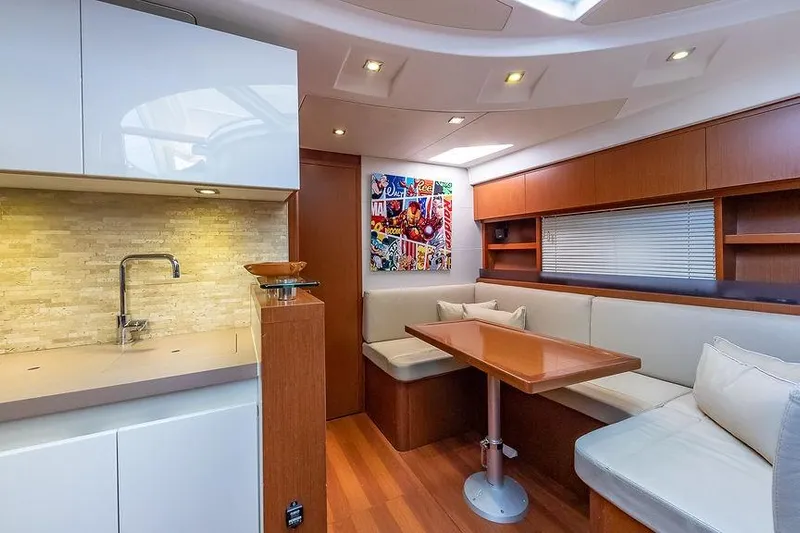 Alegria Yacht Photos Pics Luxurious interior of 2015 Beneteau Gran Turismo 44 yacht with modern kitchen and seating area.