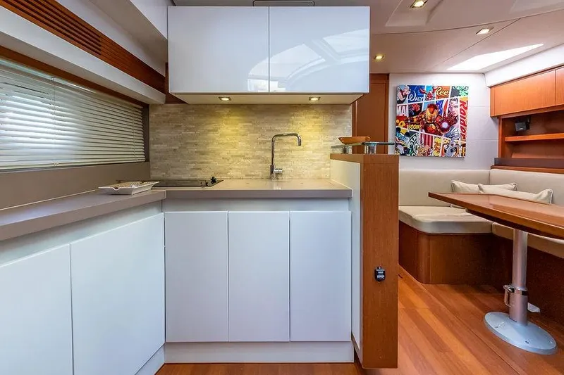 Alegria Yacht Photos Pics Luxurious interior of 2015 Beneteau Gran Turismo 44 yacht with modern kitchen and dining area.