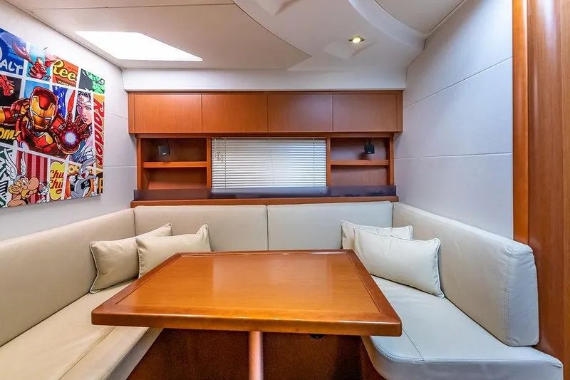 Alegria Yacht Photos Pics Luxurious interior of 2015 Beneteau Gran Turismo 44 yacht with modern seating and vibrant artwork.