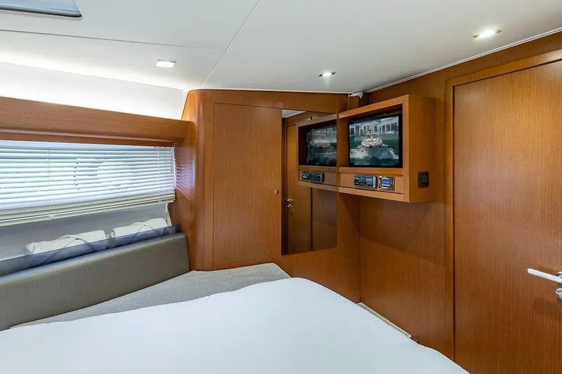 Alegria Yacht Photos Pics Luxurious interior of 2015 Beneteau Gran Turismo 44 yacht with wood paneling and modern amenities.