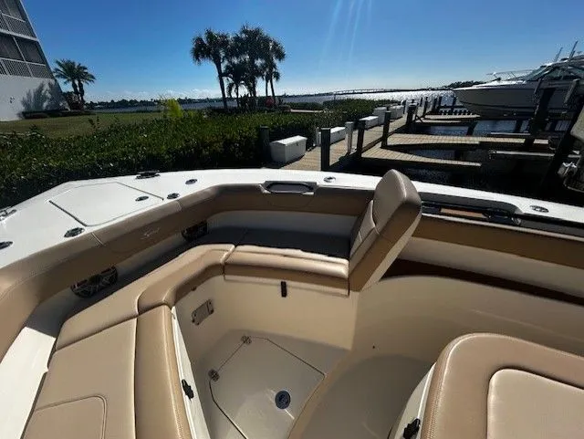  Yacht Photos Pics Scout 305 LXF 2022 boat with luxurious seating area at dock.