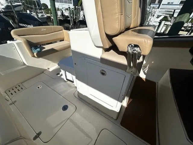  Yacht Photos Pics Interior of a 2022 Scout 305 LXF boat with beige seating.