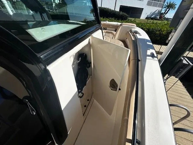  Yacht Photos Pics Scout 305 LXF 2022 with open storage compartment on deck.