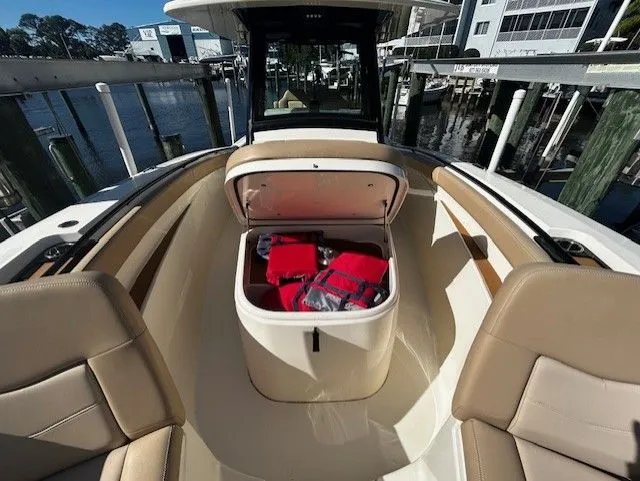  Yacht Photos Pics Scout 305 LXF 2022 with open storage and seating area.