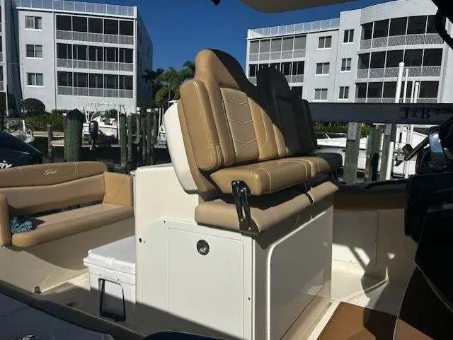  Yacht Photos Pics Interior of a 2022 Scout 305 LXF boat with beige seating.