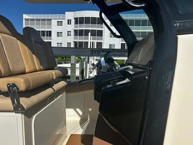  Yacht Photos Pics Interior of a 2022 Scout 305 LXF boat with modern seating.