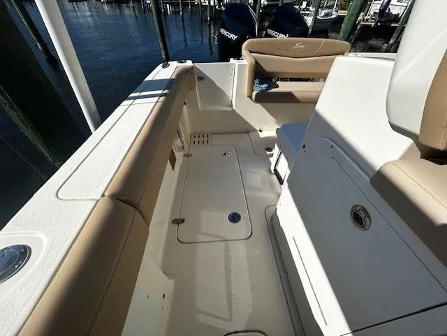  Yacht Photos Pics Interior of a 2022 Scout 305 LXF boat with beige seating.